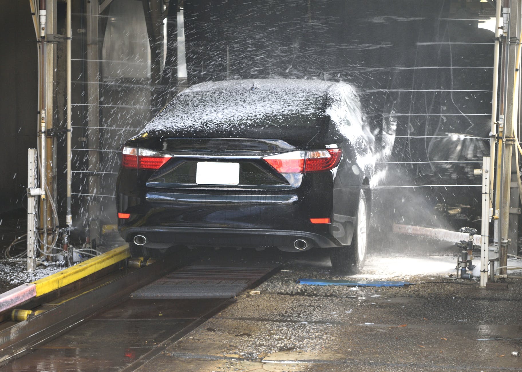 Image of a car being washed in a car wash for sale in Canada